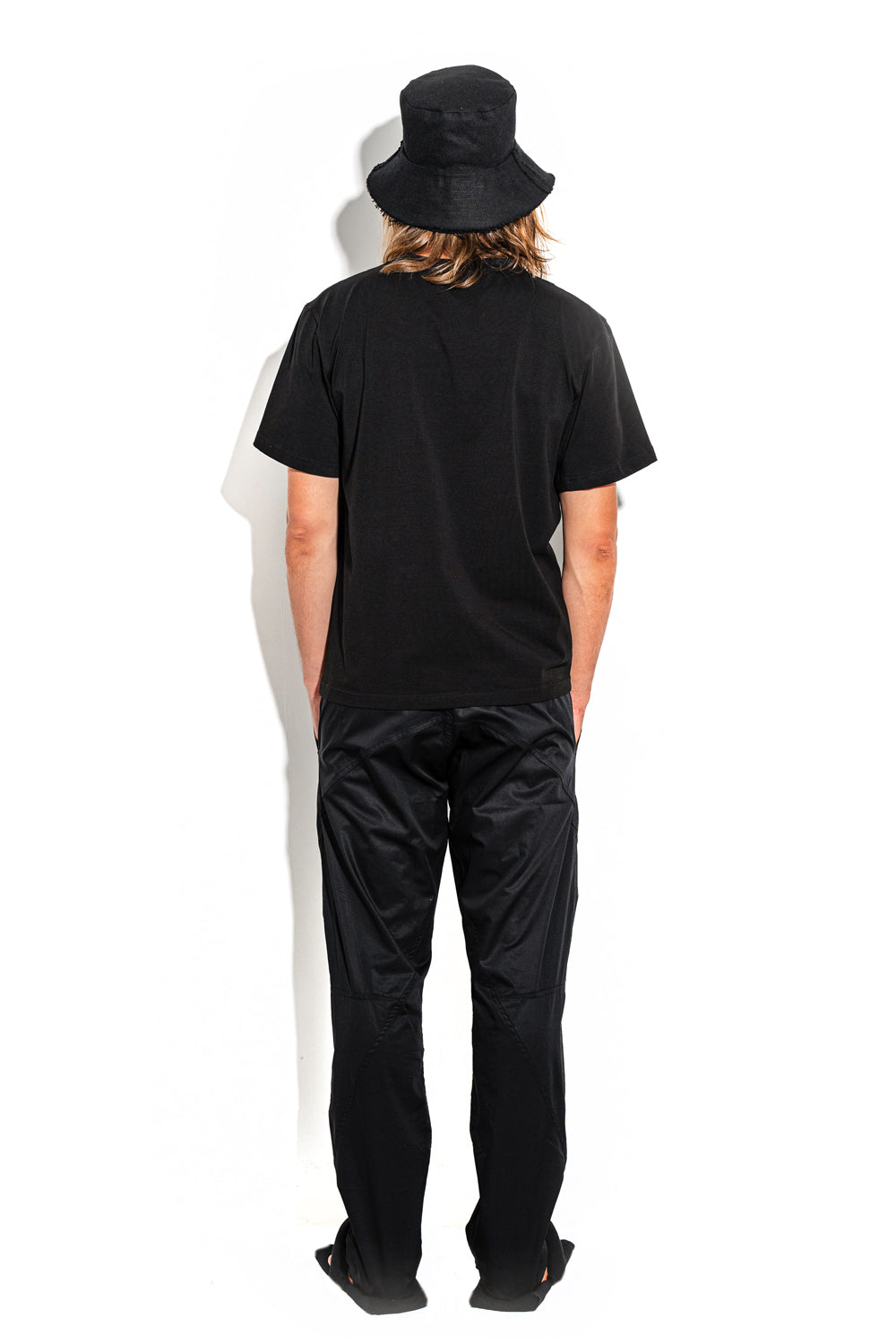 Black T-shirt with a geometric seam