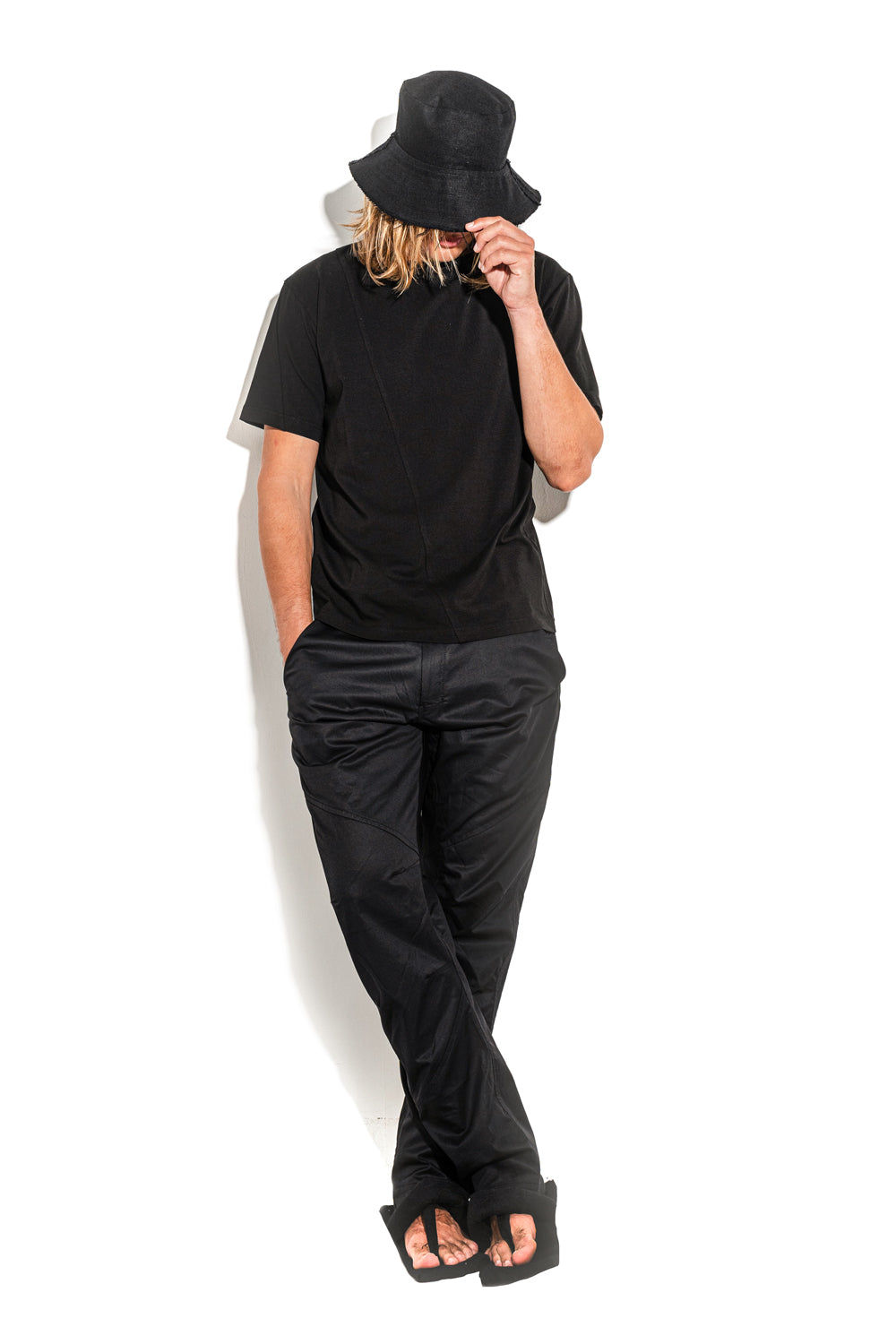 Black T-shirt with a geometric seam